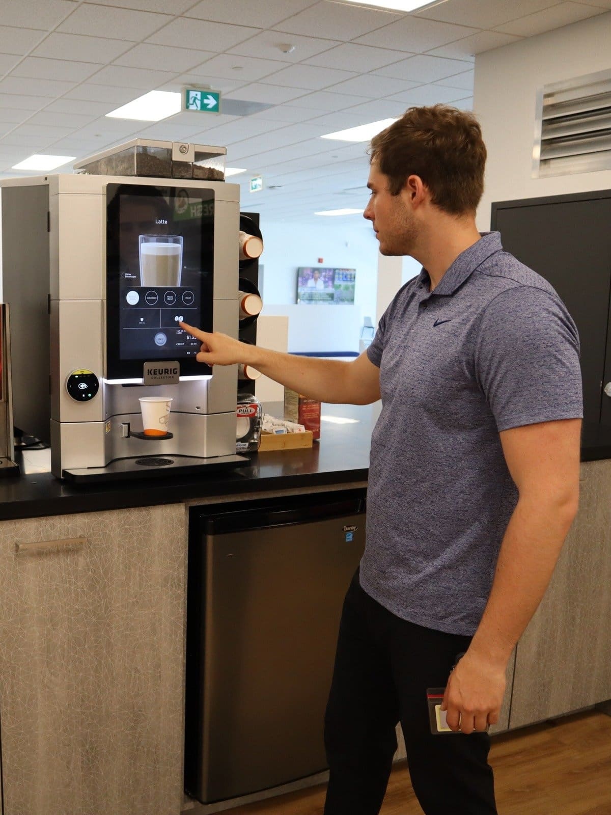 An employee getting a fancy coffee drink