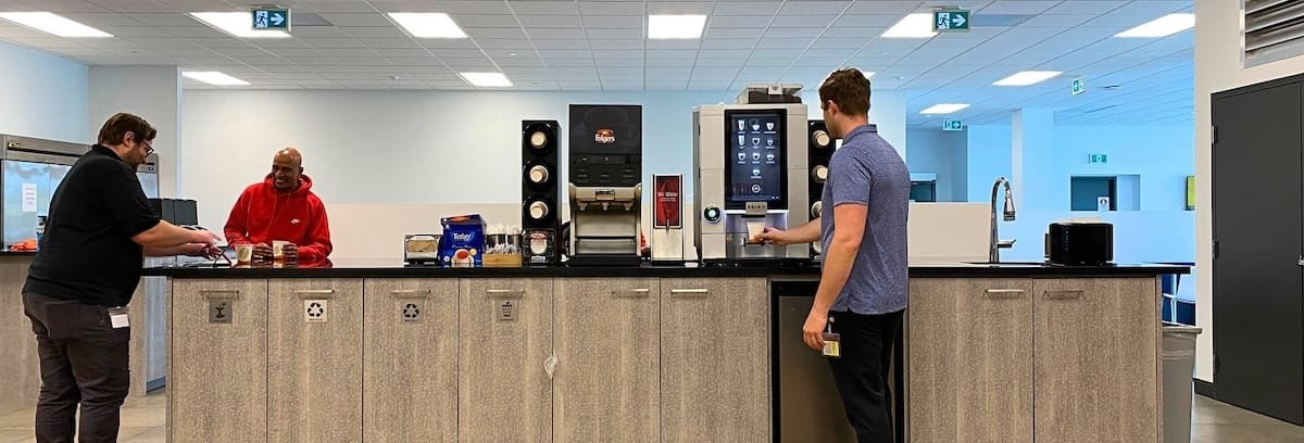 Employees enjoying a coffee at a coffee bar